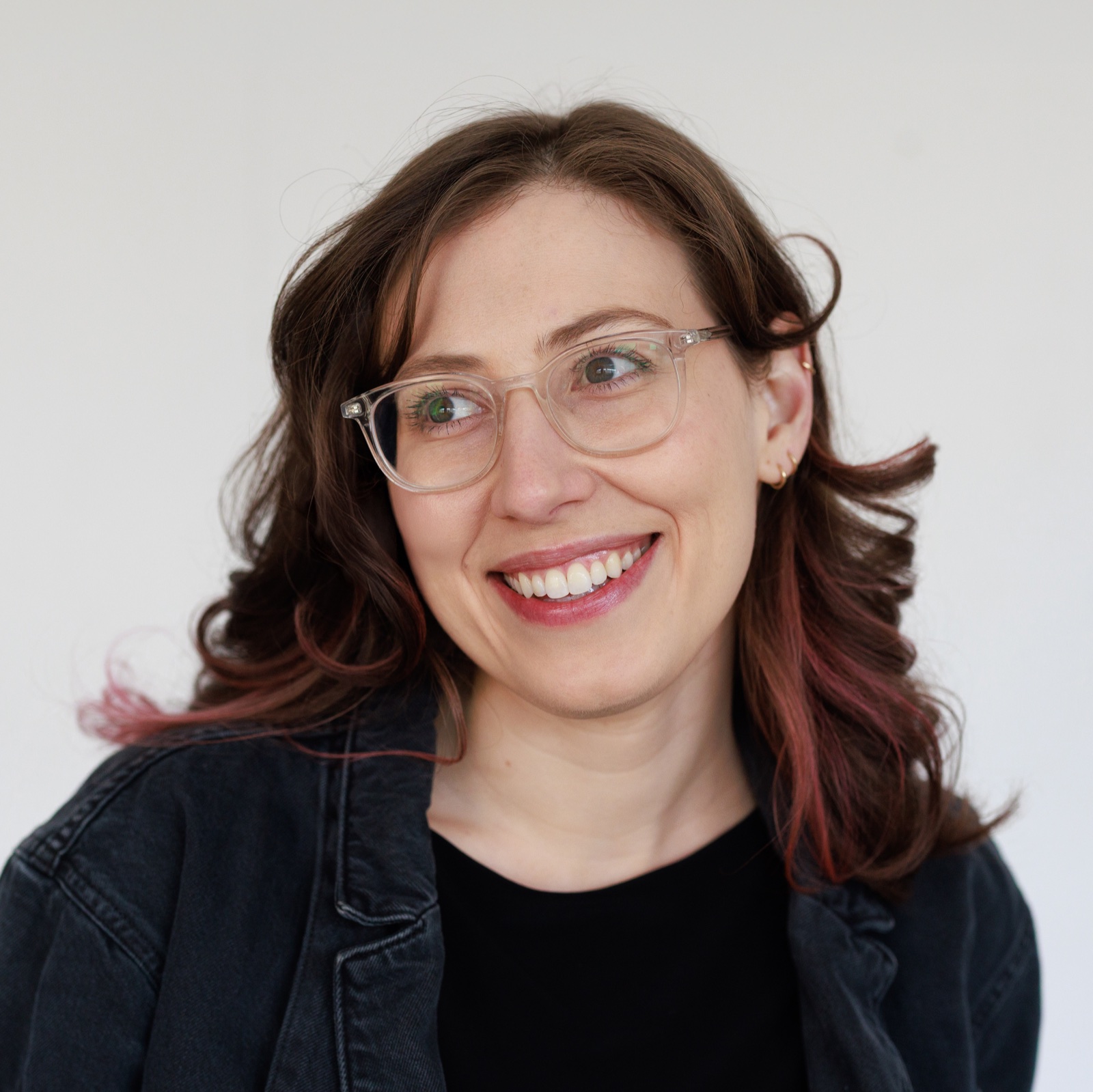 Smiling headshot of Alberta Devor against a white background